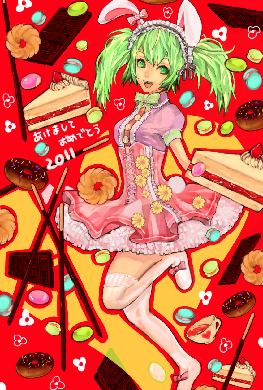 2011 :d animal_ears bunny_ears chocolate cup dated doughnut dress green_eyes green_hair headdress heart highres kneehighs leg_up moriko06 open_mouth original pink_dress pocky red_background slice_of_cake smile solo sweets teacup translation_request twintails