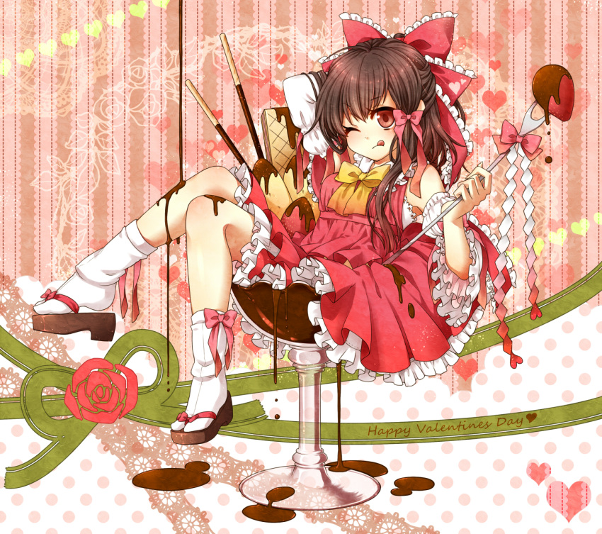 :q ;q adapted_costume bare_shoulders bow bowtie brown_eyes chocolate clog_sandals detached_sleeves food frills fruit gohei hair_bow hakurei_reimu hand_behind_head happy_valentine highres in_food kuronohana minigirl pocky red_eyes solo strawberry tabi tongue touhou valentine wings wink