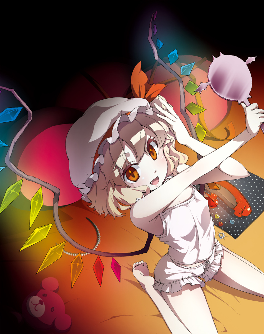 :d barefoot blonde_hair bloomers camisole fang flandre_scarlet hand_mirror highres kabayaki_unagi long_hair mirror open_mouth pillow red_eyes smile solo stuffed_animal stuffed_toy teddy_bear touhou underwear underwear_only wings