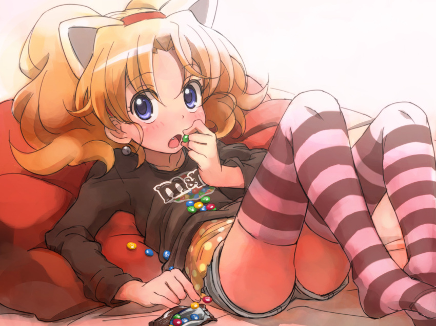 animal_ears artist_request blonde_hair blue_eyes blush candy cat_ears earrings eating fang food jewelpet_(series) jewelpet_tinkle jewelry lying m&amp;m's m&amp;m's miria_marigold_mackenzie no_shoes nyama on_back open_mouth shorts solo striped striped_legwear t-shirt thigh-highs thighhighs