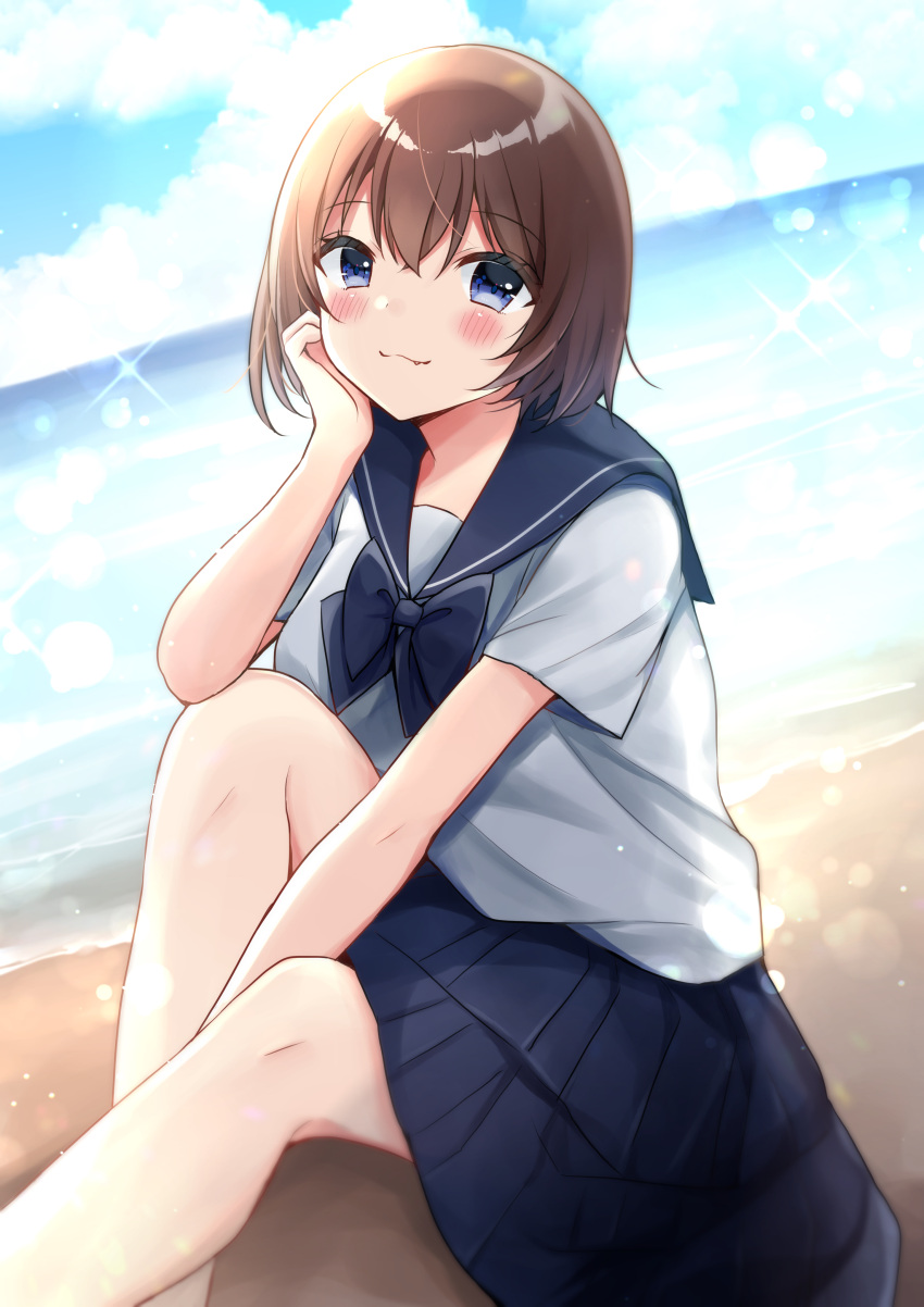 1girl :3 absurdres bangs beach between_legs black_bow black_sailor_collar black_skirt blue_eyes blue_sky blush bow brown_hair closed_mouth clouds cloudy_sky commentary_request day eyebrows_visible_through_hair fang fang_out feet_out_of_frame hair_between_eyes hand_between_legs hand_up highres horizon knee_up looking_at_viewer minami_saki ocean original outdoors pleated_skirt sailor_collar sand school_uniform serafuku short_sleeves sitting skirt sky smile solo
