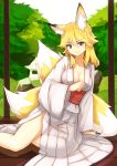  1girl animal_ears arm_support blonde_hair blue_eyes breasts cleavage fox_ears fox_tail japanese_clothes kimono looking_at_viewer multiple_tails nosuku original short_hair smile solo tail 