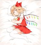  1girl ascot blonde_hair flandre_scarlet hair_ribbon looking_at_viewer lying nanana_(chicken_union) no_hat no_headwear no_shoes on_side pillow puffy_sleeves red_eyes ribbon shirt short_sleeves side_ponytail skirt skirt_set solo thigh-highs touhou vest white_legwear wings zettai_ryouiki 