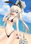  1girl beach bikini blonde_hair blue_eyes fuuma_nagi highleg highleg_bikini highleg_swimsuit innertube kantai_collection long_hair personification popsicle shimakaze_(kantai_collection) swimsuit watermelon_bar 