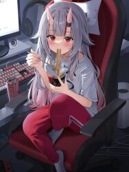  1girl blush chair chopsticks commentary computer computer_keyboard double-parted_bangs eating feet_on_chair food full_body gabuchi grey_hair hair_over_shoulder headphones headphones_removed highres holding holding_chopsticks holding_food hololive horns long_hair looking_at_viewer monitor monster_energy nakiri_ayame nintendo_switch noodles on_chair oni pants pillow ramen red_eyes red_pants red_streaks shirt short_sleeves sidelighting sidelocks sitting skin-covered_horns socks sweat sweatdrop symbol-only_commentary white_shirt white_socks 