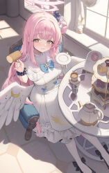  1girl absurdres blue_archive cake coffee cup dress feathered_wings flower food footwear_ribbon fork hair_bun hair_flower hair_ornament halo highres holding holding_fork holding_plate long_hair looking_at_viewer macaron mika_(blue_archive) pantyhose pink_hair pink_halo pipi_ya plate single_side_bun sitting solo teacup teapot white_dress white_pantyhose wings 