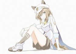  1girl animal_ears ascot black_shorts black_socks blue_cape blue_eyes blush breasts brown_hair cape cheval_grand_(grand_itineraire)_(umamusume) cheval_grand_(umamusume) closed_mouth ear_covers ears_through_headwear gloves hair_between_eyes hakugitsu hat hat_belt highres horse_ears horse_girl horse_tail jacket long_hair looking_at_viewer multicolored_hair peaked_cap shoes shorts simple_background single_glove sitting smile socks solo streaked_hair tail umamusume white_background white_hair white_hat white_jacket yellow_ascot 