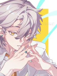  1boy absurdres aqua_gemstone artist_name border caelus_(honkai:_star_rail) collared_shirt commentary earrings english_commentary fingernails gem grey_hair grey_pupils hair_between_eyes hands_up highres honkai:_star_rail honkai_(series) jewelry lips long_sleeves looking_at_viewer male_focus necktie outside_border ring rongyuan_gulu shirt short_hair simple_background solo sparkle tape teeth trailblazer_(honkai:_star_rail) upper_body white_border white_shirt yellow_background yellow_eyes yellow_necktie 