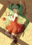  1girl animal_ears cat_ears cat_tail dress green_eyes green_hair hatsune_miku long_hair lying maya_g on_side socks tail twintails very_long_hair vocaloid 