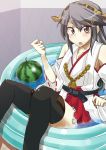  1girl bare_shoulders black_hair black_legwear blush detached_sleeves food fruit hairband haruna_(kantai_collection) highres japanese_clothes kantai_collection kurosawa-san long_hair looking_at_viewer miko open_mouth partially_submerged personification solo thighhighs watermelon 