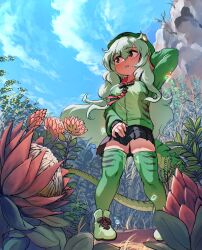  1girl black_bow black_bowtie black_skirt blush boomslang_(kemono_friends) boots bow bowtie flower from_below green_boots green_hair green_hoodie green_thighhighs hair_between_eyes highres hood hood_up hoodie kemono_friends long_hair long_sleeves mcgunngu plant pleated_skirt print_hoodie print_thighhighs sidelocks skirt snake_girl snake_print snake_tail solo tail thigh-highs zettai_ryouiki 