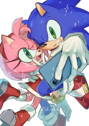  1boy 1girl amy_rose blue_fur bracelet commentary dress furry furry_female furry_male furry_with_furry gloves gold_bracelet gold_buckle hand_on_another's_back hand_on_own_face hedgehog_boy hedgehog_girl highres holding holding_phone jewelry konjiki_ringo one_eye_closed phone pink_fur red_dress red_shoes selfie shoes simple_background sonic_(series) sonic_the_hedgehog sparkle symbol-only_commentary taking_picture twitter_username v white_background white_gloves 