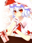  1girl ascot blouse blue_hair blush bow box chocolate fingernails hair_between_eyes hand_on_own_cheek hat hat_bow highres junior27016 looking_at_viewer mob_cap puffy_sleeves red_eyes remilia_scarlet ribbon short_sleeves smile solo table touhou valentine wristband 