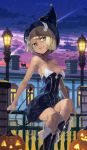  1girl aqua_eyes barefoot black_dress blonde_hair boots breasts cat cleavage dark_skin demon_girl demon_tail dress halloween hat horns knee_boots lamppost night night_sky original pointy_ears short_hair sitting sky smirk solo strapless_dress tail toro 