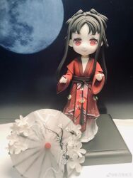  1girl absurdres black_hair black_ribbon bow-shaped_hair braid cherry_blossoms chinese_clothes chinese_commentary clay_(medium) closed_mouth commentary_request deformed eyelashes floral_print flower flower-shaped_pupils full_body full_moon ganyue_ganganyue hanfu happy highres layered_sleeves lipstick long_hair long_sidelocks long_sleeves looking_at_viewer makeup moon night nikki_(series) oil-paper_umbrella outdoors parted_bangs photo_(medium) photo_background pink_lips red_eyes red_hanfu red_tabard ribbon shining_nikki short_over_long_sleeves short_sleeves sidelocks smile solo standing straight_hair stylist_(nikki) symbol-shaped_pupils tabard twin_braids umbrella unconventional_media waist_ribbon waist_tassel watermark weibo_watermark white_flower white_umbrella wide_sleeves 