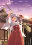  1girl ahoge blush box broom brown_eyes donation_box hairband hajime_kazuhito japanese_clothes long_hair long_sleeves looking_at_viewer miko open_mouth original shrine silver_hair smile solo sunset wide_sleeves 