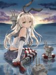  1girl bare_shoulders blonde_hair butt_crack eyelashes gloves green_eyes highres horizon kantai_collection long_hair reflection rensouhou-chan shimakaze_(kantai_collection) sitting skirt striped striped_legwear thighhighs tokoaoki 