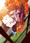  1girl ainili autumn_leaves book brown_hair capelet closed_eyes cookie dress food grass hairband long_hair lying on_back original solo 
