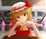  1girl blonde_hair elbow_rest flandre_scarlet gin_fuaru hat hat_ribbon head_rest head_tilt interlocked_fingers light_smile looking_at_viewer mob_cap puffy_short_sleeves puffy_sleeves red_eyes ribbon short_hair short_sleeves side_ponytail skirt skirt_set slit_pupils smile solo table touhou wings 