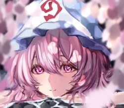  1girl aoyadazo blue_hat blurry blurry_background closed_mouth commentary_request hat highres looking_at_viewer mob_cap pink_eyes pink_hair portrait saigyouji_yuyuko short_hair smile solo touhou triangular_headpiece 