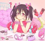  1girl bed black_hair bottle bow bracelet chin_rest dress earrings hair_bow heart heart-shaped_pupils highres jewelry lipstick love_live!_school_idol_project lying makeup makeup_brush mirror on_stomach pillow red_eyes ribbon ring scrunchie solo strap_slip symbol-shaped_pupils twintails yazawa_nico yutsumoe 