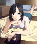  1girl bare_legs barefoot bed black_eyes black_hair breasts cleavage computer desk highres kagematsuri lying on_stomach original pillow shorts solo tablet_pc 