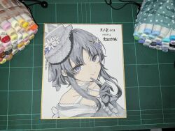  1girl ab_hinatthi art_tools_in_frame artist_name bare_shoulders black_hair black_hat black_kimono butterfly_hair_ornament closed_mouth commentary_request dated dress flower frilled_sleeves frills furisode hair_ornament hat hat_flower highres housho_margo japanese_clothes kimono lolita_fashion long_sleeves mahou_shoujo_no_majo_saiban neck_ribbon off-shoulder_dress off_shoulder photo_(medium) portrait ribbon shikishi short_hair signature simple_background smile solo top_hat traditional_media violet_eyes wa_lolita white_background wide_sleeves 