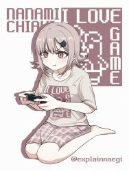  1girl :t barefoot breasts brown_hair character_name cheek_squash commentary_request controller danganronpa_(series) danganronpa_2:_goodbye_despair explainnaegi grey_shirt hair_ornament highres holding holding_controller korean_commentary medium_breasts medium_hair nanami_chiaki pink_eyes shirt solo watermark white_background 