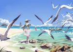  1girl absurdres bird blue_sky braid brown_hair clouds crab from_behind hat highres holding holding_shoes long_hair ocean original outstretched_arms pagoda partially_submerged pleated_skirt ribbon rock sailor_collar sand seagull shoes shoes_removed skirt sky stflash sun_hat 