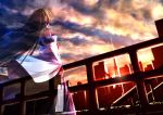  1girl building clouds cloudy_sky detached_sleeves gohei green_hair hair_tubes kochiya_sanae long_hair railing revision ryosios shirt skirt sky skyscraper solo sunset tokyo_(city) tokyo_tower touhou transparent very_long_hair wide_sleeves 