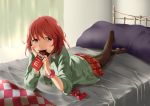  1girl absurdres arm_support bed chocolate eating highres lying on_stomach original pantyhose pillow redhead short_hair skirt smile solo sweater violet_eyes 