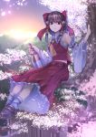  1girl armpits ascot bare_shoulders bottle bow brown_eyes brown_hair cherry_blossoms detached_sleeves hair_bow hair_tubes hakurei_reimu highres in_tree koruse long_sleeves looking_at_viewer open_mouth petals sake_bottle shirt sitting sitting_in_tree skirt solo sunset touhou tree wide_sleeves 