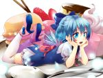  1girl blue_eyes blue_hair bow cake cirno dress fang food fruit hair_bow hands_on_own_cheeks hands_on_own_face highres hijiri-ssh looking_at_viewer lying macaron on_stomach open_mouth short_hair solo spoon strawberry thigh-highs touhou white_legwear wings 
