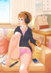  1girl barefoot blue_eyes brown_hair can cellphone controller couch eating headphones highres legs magazine mouth_hold original phone potato_chips remote_control short_hair sitting smartphone solo 