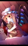  1girl akabeko_(ku-enn) blonde_hair check_commentary doll_hug flandre_scarlet hat hat_ribbon highres letterboxed looking_at_viewer mob_cap pout puffy_sleeves red_eyes ribbon shirt short_sleeves side_ponytail sitting skirt skirt_set solo stuffed_animal stuffed_bunny stuffed_toy teddy_bear touhou vest wariza wings 