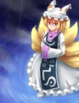  1girl anata_(lighttuner) blonde_hair breasts dress fox_tail frilled_dress frills hands_in_sleeves hat highres kitsune multiple_tails perfect_cherry_blossom rain ripples shoes short_hair sleeves_past_wrists smile solo tail touhou water yakumo_ran yellow_eyes 