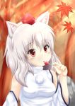  1girl animal_ears autumn_leaves bare_shoulders blush breasts candy detached_sleeves hat inubashiri_momiji leaf lollipop looking_at_viewer miyarinn nature pom_pom_(clothes) red_eyes short_hair silver_hair solo tokin_hat tongue tongue_out touhou tree wolf_ears 