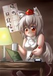  1girl animal_ears bare_shoulders blush breasts chikinman cup happy hat ink inubashiri_momiji mug pen pom_pom_(clothes) red_eyes short_hair silver_hair sitting smile solo tail tokin_hat touhou translation_request wolf_ears wolf_tail 
