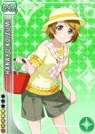  1girl blush brown_hair bucket character_name green_background hat koizumi_hanayo love_live!_school_idol_project official_art scarf short_hair shorts smile solo violet_eyes 
