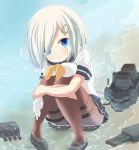  1girl blue_eyes breasts gloves_removed hair_ornament hair_over_one_eye hairclip hamakaze_(kantai_collection) highres kantai_collection leg_hug looking_at_viewer maromi_gou pantyhose personification school_uniform serafuku shore short_hair silver_hair skirt solo thighband_pantyhose water 