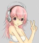  1girl blush breasts cleavage headphones large_breasts long_hair looking_at_viewer lowres nitroplus open_mouth pink_eyes pink_hair smile solo super_sonico tubetop yam-potong 