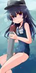  1girl akatsuki_(kantai_collection) black_hair haku-un hat highres kantai_collection long_hair school_swimsuit swimsuit torpedo violet_eyes 