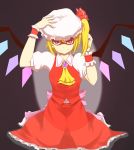  1girl ascot black_background blonde_hair bow brooch colored_eyelashes crystal dress fang_out flandre_scarlet hair_bow hand_on_headwear hat highres jewelry looking_at_viewer mob_cap red_dress red_skirt shaded_eyes short_hair side_ponytail skirt skirt_set smile solo touhou tsutsunuke wings wrist_cuffs 
