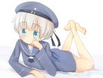  1girl aiba_kou barefoot beret blue_eyes blush chin_rest clothes_writing crossed_legs hat kantai_collection looking_at_viewer lying on_stomach sailor_dress short_hair silver_hair solo z1_leberecht_maass_(kantai_collection) 