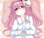  1girl alternate_costume blush commentary_request fox_mask hammer_(sunset_beach) hata_no_kokoro long_hair long_sleeves looking_at_viewer lying mask on_back pajamas pillow pink_eyes pink_hair solo touhou unbuttoning 