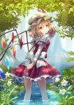  1girl arms_behind_back asymmetrical_hair blonde_hair butterfly dappled_sunlight dress flandre_scarlet flower forest hat hat_ribbon looking_at_viewer looking_back mob_cap monmonga nature pond red_dress red_eyes ribbon sash side_ponytail smile solo touhou water wings 