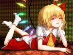  1girl ascot blackmoth blonde_hair blush crossed_legs fangs flandre_scarlet hand_rest highres lying no_hat on_stomach red_eyes short_hair side_ponytail smile socks solo touhou white_legwear wings 