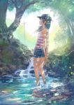  1girl arms_behind_back bare_shoulders baseball_cap black_eyes brown_hair dappled_sunlight flat_chest hands_clasped hat highres horizontal_stripes light_particles long_hair original partially_submerged power_lines profile shorts sketch solo standing stream striped_tank_top sunlight tank_top telephone_pole tree wading water wind you_(shimizu) 
