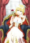  1girl absurdres ahoge blonde_hair breasts chair cleavage curtains dress epaulettes fate/extra fate_(series) flower green_eyes hair_ribbon highres looking_at_viewer petals red_dress red_rose ribbon rose rose_petals saber_extra shimaneko short_hair sitting solo 