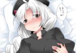  1girl black_eyes blush braid breasts bust commentary_request hammer_(sunset_beach) hat large_breasts long_hair looking_at_viewer lying nurse nurse_cap on_back pillow silver_hair smile solo touhou translation_request yagokoro_eirin 